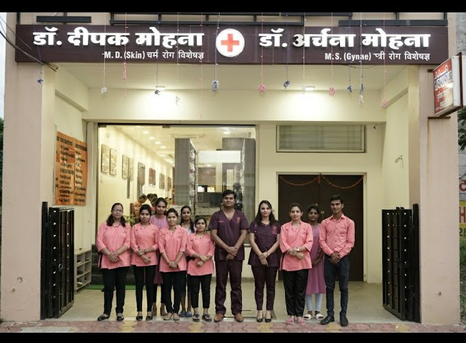 Team of doctors and staff standing in front of Dr. Mohana's Skin and Gynae Clinic
