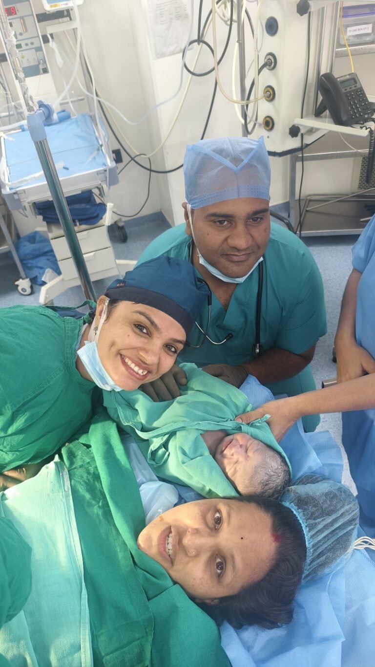 Dr. Archana Mohana with her medical team and a joyful mother after successful childbirth in Indore