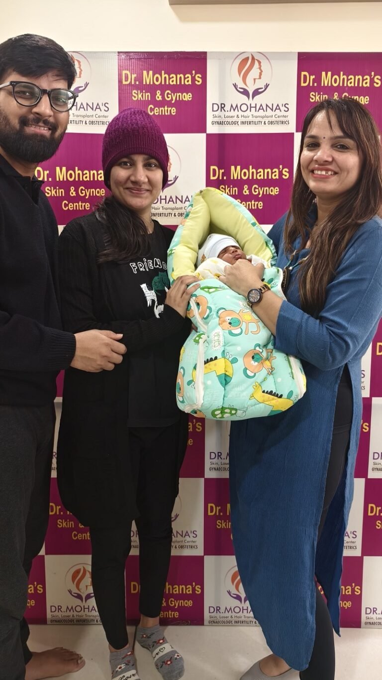 Dr. Archana Mohana with a happy family and newborn baby at Dr. Mohana’s Skin & Gynae Centre, celebrating a successful delivery.